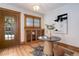 Foyer featuring hardwood floors, a striking window display, and a round table for an elegant entry at 729 E 10Th Ave, Denver, CO 80203