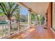 Inviting front porch featuring classic columns, wood floors, and ample space for outdoor seating at 729 E 10Th Ave, Denver, CO 80203