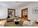Bright living room with hardwood floors, neutral-toned furniture, and large windows that provide ample natural light at 729 E 10Th Ave, Denver, CO 80203
