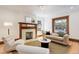 Well-lit living room highlighting hardwood floors, a comfortable sofa, and an inviting ambiance at 729 E 10Th Ave, Denver, CO 80203