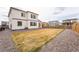 Expansive backyard featuring gravel accents, wooden fence, and a tidy lawn, creating a versatile outdoor space at 13329 Newport Cir, Thornton, CO 80602