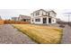 Large backyard with a gravel perimeter, wooden fence, well-kept lawn, and space for outdoor enjoyment at 13329 Newport Cir, Thornton, CO 80602