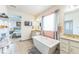 Luxurious bathroom with a soaking tub, double vanity, and stylish fixtures for a spa-like experience at 13329 Newport Cir, Thornton, CO 80602