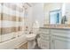 Cozy bathroom with shower-tub combination, granite vanity, and a neutral color palette at 13329 Newport Cir, Thornton, CO 80602