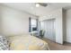 Bright bedroom with a bed, desk, and closet, creating a practical and inviting atmosphere at 13329 Newport Cir, Thornton, CO 80602