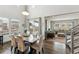 Bright dining room boasts hardwood floors, stylish decor, and easy access to the living room and outdoor patio at 13329 Newport Cir, Thornton, CO 80602