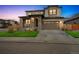 Beautiful two-story home with a stone facade and a well-manicured lawn, creating curb appeal at 13329 Newport Cir, Thornton, CO 80602
