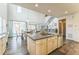 Open concept kitchen with large island, stainless steel appliances, adjacent to dining and living area at 13329 Newport Cir, Thornton, CO 80602