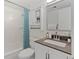 Well-maintained bathroom with shower-tub, vanity, and white tile at 9100 E Girard Ave # 7, Denver, CO 80231