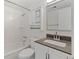 Clean bathroom with subway tile shower and vanity with storage at 9100 E Girard Ave # 7, Denver, CO 80231