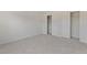 Clean and open bedroom with carpet flooring and dual closets at 9100 E Girard Ave # 7, Denver, CO 80231