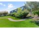 Exterior view of a townhome with well-maintained landscaping and a walkway at 9100 E Girard Ave # 7, Denver, CO 80231