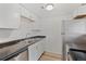 Efficient kitchen with stainless steel refrigerator and bright white cabinetry at 9100 E Girard Ave # 7, Denver, CO 80231