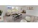 Bright living room with large windows, stylish furniture, and an open floor plan at 9100 E Girard Ave # 7, Denver, CO 80231