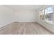 Bright living room with durable floors, big window, and a fresh coat of paint at 9100 E Girard Ave # 7, Denver, CO 80231