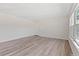 Well-lit living room featuring modern wood floors and neutral paint at 9100 E Girard Ave # 7, Denver, CO 80231