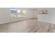 Bright living room featuring durable floors, ample windows, and a view to the kitchen at 9100 E Girard Ave # 7, Denver, CO 80231