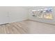 Cozy living room with durable floors, fresh paint, and a large window at 9100 E Girard Ave # 7, Denver, CO 80231