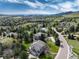 Scenic aerial view of a residential area with picturesque landscaping and mountain backdrop at 8 Mountain Willow Dr, Littleton, CO 80127