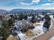 Stunning aerial view of the home's lush landscaping and neighborhood at 8 Mountain Willow Dr, Littleton, CO 80127