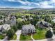 Expansive aerial view of home with beautiful landscaping and mountain views in the distance at 8 Mountain Willow Dr, Littleton, CO 80127