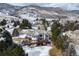 Home with a two story deck nestled in a community surrounded by mountains at 8 Mountain Willow Dr, Littleton, CO 80127