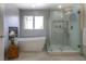 Modern bathroom with freestanding tub, glass-enclosed shower, and contemporary finishes for a spa-like experience at 8 Mountain Willow Dr, Littleton, CO 80127