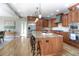 Open concept kitchen with a large island, stainless steel appliances, granite countertops, and ample cabinet space at 8 Mountain Willow Dr, Littleton, CO 80127