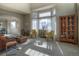 Spacious living area with a bay window, hardwood floors, and an open layout at 8 Mountain Willow Dr, Littleton, CO 80127
