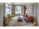 Bright living room with a large arched window, comfortable seating, and elegant decor at 8 Mountain Willow Dr, Littleton, CO 80127