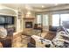 Cozy living room with fireplace, recessed lighting, and a large sectional sofa at 8 Mountain Willow Dr, Littleton, CO 80127