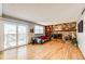 Living room with fireplace, built-in shelving, hardwood floors at 3562 S Richfield Cir, Aurora, CO 80013