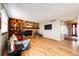 Living room with hardwood floors, fireplace, and view of entry at 3562 S Richfield Cir, Aurora, CO 80013