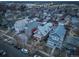 Aerial view showcasing homes and street parking in a vibrant neighborhood during twilight at 515 S Grant St, Denver, CO 80209
