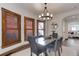 Inviting dining room with hardwood floors, natural light, and modern light fixture at 515 S Grant St, Denver, CO 80209