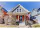 Charming brick home featuring a cozy front porch, well-maintained landscaping, and classic architectural details at 515 S Grant St, Denver, CO 80209