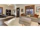 Comfortable living room with a large sofa, ottoman, and area rug, with a view to the front entrance at 515 S Grant St, Denver, CO 80209