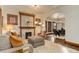 Open-concept living room with a fireplace, and view into the dining area at 515 S Grant St, Denver, CO 80209