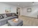 Bright living room featuring neutral carpet, a walk-in closet and modern decor at 515 S Grant St, Denver, CO 80209