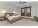 Comfortable bedroom with a queen-sized bed, neutral colors, and natural light from the window at 515 S Grant St, Denver, CO 80209