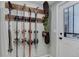 Practical mudroom with custom rack for skis and snowboard near door at 515 S Grant St, Denver, CO 80209