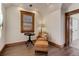 Cozy sitting area with chair and ottoman, natural light, and hardwood floors at 515 S Grant St, Denver, CO 80209