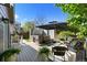 Relaxing deck with hot tub, umbrella-covered seating, and pleasant backyard views at 2667 E 132Nd Ave, Thornton, CO 80241