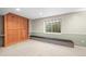 Basement bedroom featuring a murphy bed, built-in cabinets, and an egress window, providing ample space and functionality at 2667 E 132Nd Ave, Thornton, CO 80241