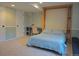 Bedroom includes a murphy bed, carpet, and built in desk at 2667 E 132Nd Ave, Thornton, CO 80241