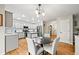 Inviting kitchen with granite counters, stainless appliances, and adjacent dining area at 2667 E 132Nd Ave, Thornton, CO 80241