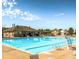 Relaxing pool with an open air clubhouse, lounge chairs, and a diving board for a resort-like feel at 2667 E 132Nd Ave, Thornton, CO 80241