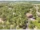 Aerial view of property nestled in a forested area, offering privacy and tranquility at 1240 Lone Scout Lookout, Monument, CO 80132
