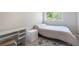 Bright bedroom with a modern minimalist design featuring white walls and furniture at 1240 Lone Scout Lookout, Monument, CO 80132