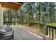 Relaxing deck view surrounded by mature trees and greenery, ideal for nature lovers at 1240 Lone Scout Lookout, Monument, CO 80132